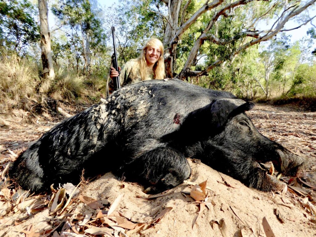 Hunter with a wild boar